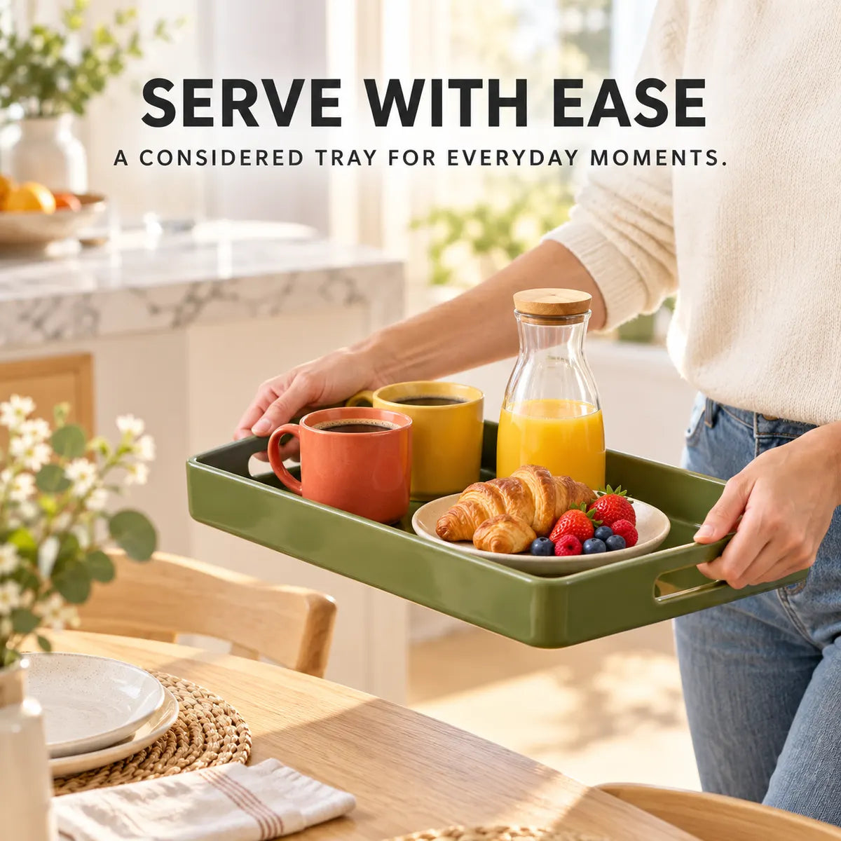 Olive-green Verdelique tray carrying mugs, juice and breakfast pastries