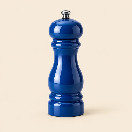 Verdelique cobalt-blue manual pepper grinder on a warm ivory background
