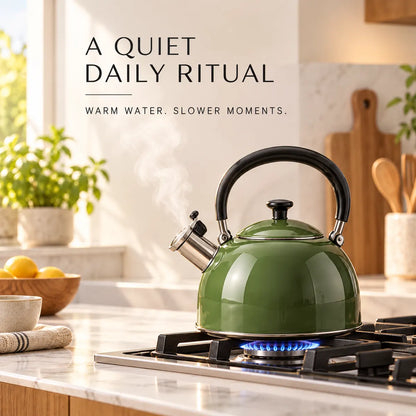 Olive-green kettle heating in a bright modern kitchen