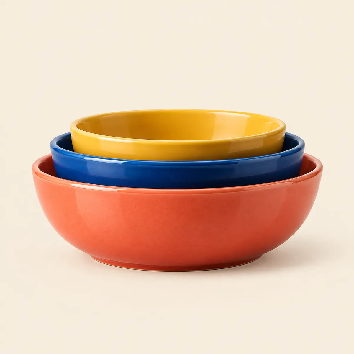 Verdelique three-piece nesting bowl set in coral orange, blue and yellow